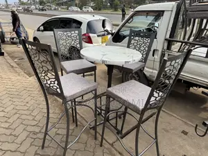 White High Round Table And High Bar Chairs