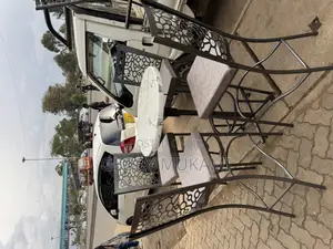 White High Round Table And High Bar Chairs