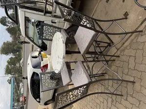 White High Round Table And High Bar Chairs