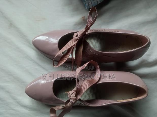 Heels One Is Clarks Other Is White Heels