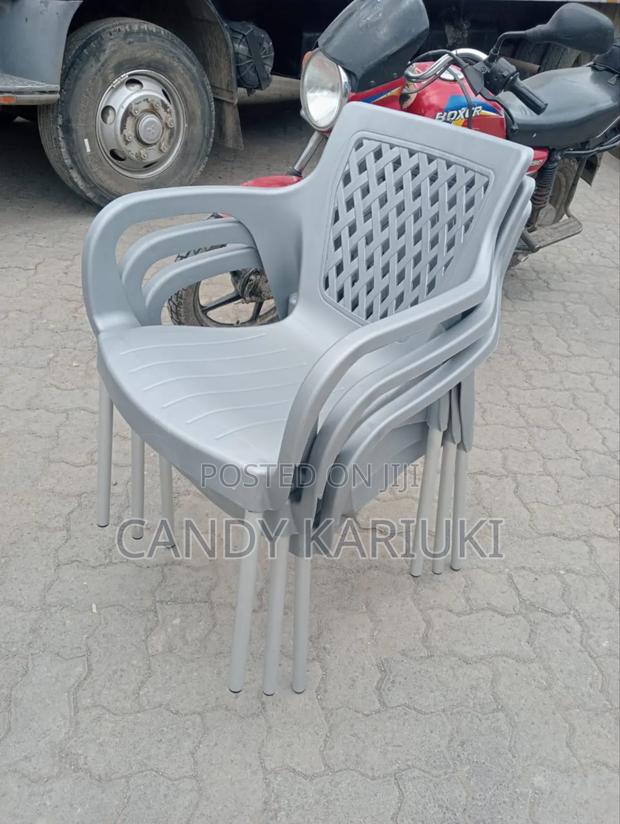 Stackable Grey Plastic Chairs With Steel Legs