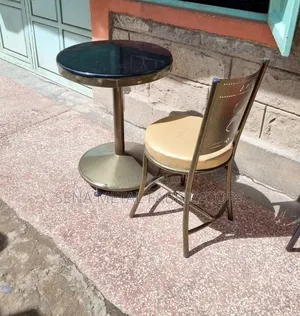 Restaurant Table With Black Marble Top.