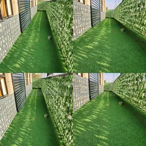 Artificial Green Grass Carpets With Dark Green Privacy Fence