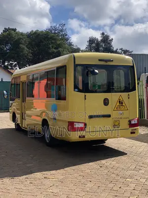Toyota Coaster 2019 Yellow