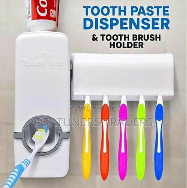 Toothpaste Dispenser With an Attached Toothbrush Holder - main view
