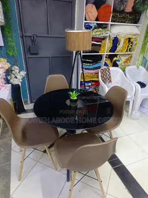 Black Round Glass Table With Brown Chairs Dining Table