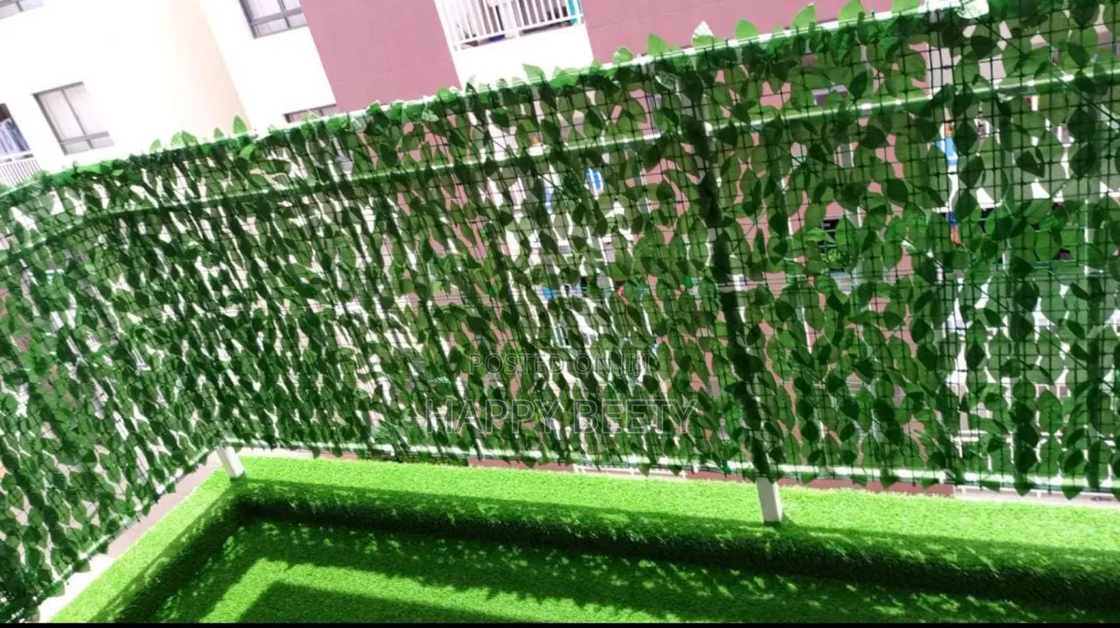 Elevating Your Balcony With Grass Carpet and Privacy Fence