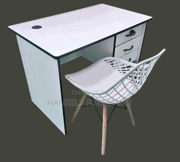 White Black Table and Perforated Chair