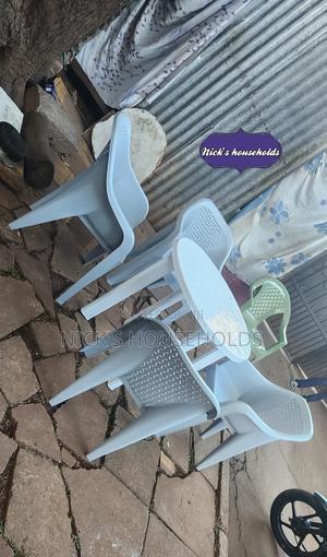 4 Skyplast Plastic Chairs With a Round Plastic Table Set - thumbnail 2