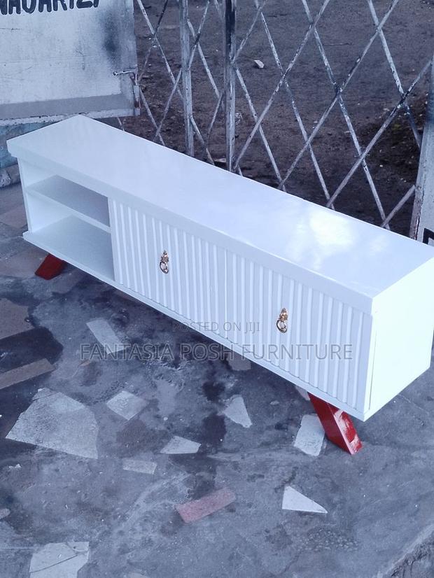 Tv Stand With Decorative Handles and Red Legs