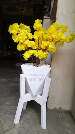 Flowers in Vase and Pebble Stones on Stand
