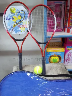 Badminton Racket With a Tennis Ball