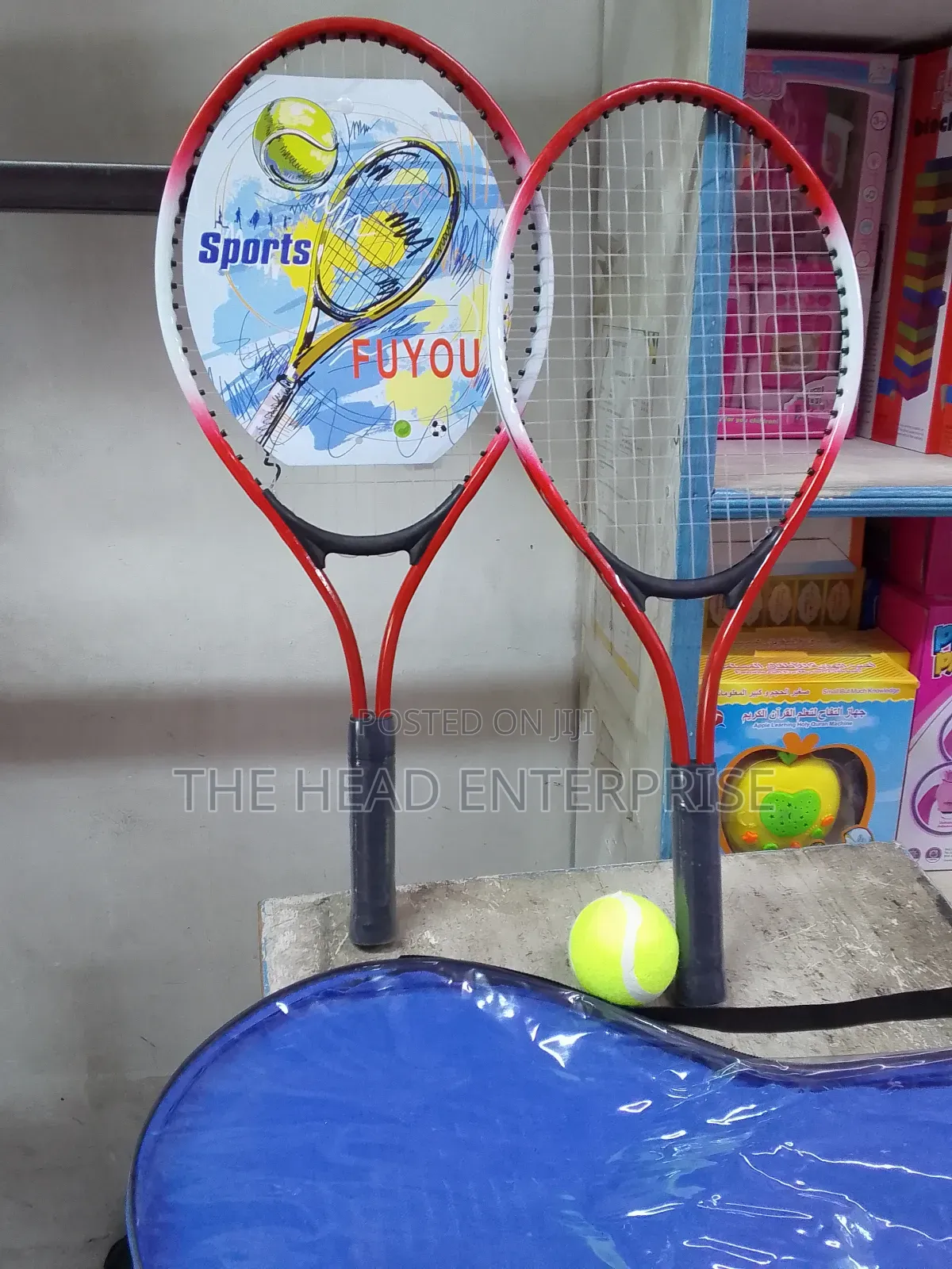 Badminton Racket With One Tennis Ball and a Pair of Racket