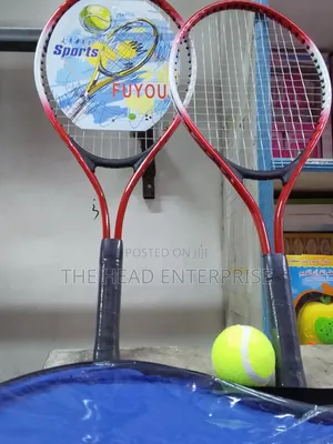 Badminton Racket With One Tennis Ball and a Pair of Racket