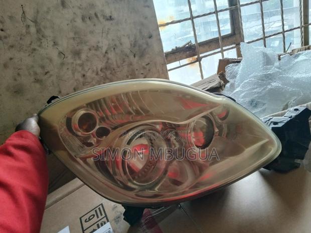 Mazda Verissa Headlight Mon Xenon - main view