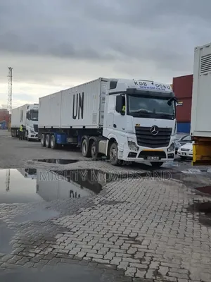 Container. Trailer at Hand for Transport.