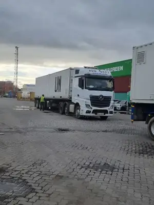 Container. Trailer at Hand for Transport.