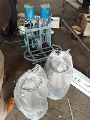 Dual Barrel Milking Machine.