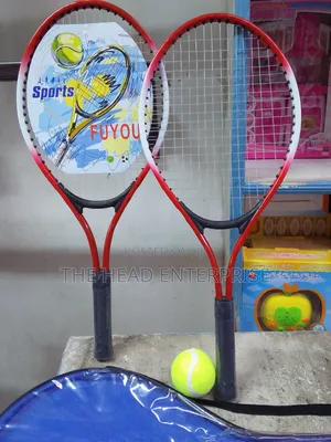 Badminton Set With a Green Tennis Ball