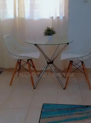 Round Table +Two Eames Dining Chair