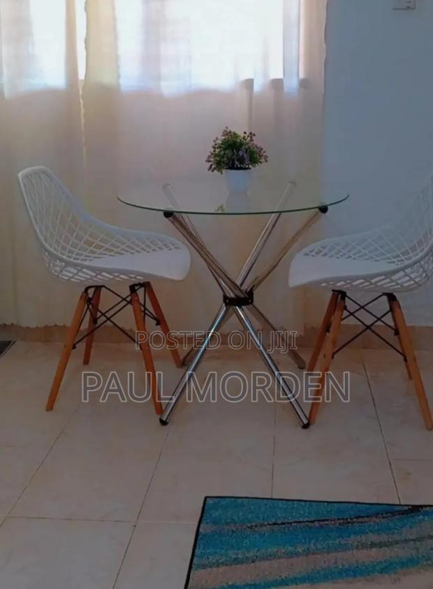 Round Table +Two Eames Dining Chair