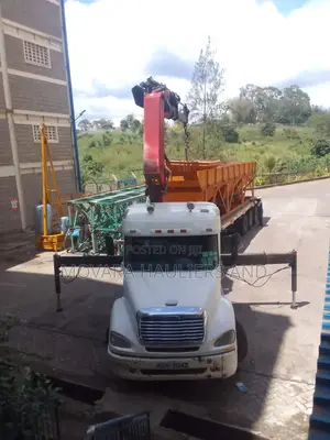 Trailer With Lifting Arm at Hand for Services