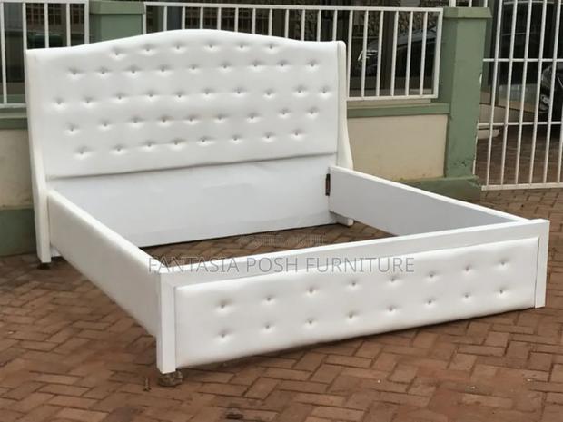 5x6 Elegant White Upholstered Bed Frame With Tufted Detailing - main view