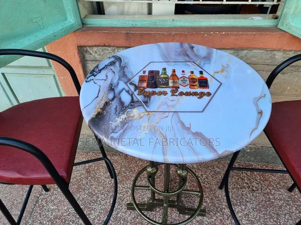 Bar-High Stools With a Unique Table. - thumbnail 2
