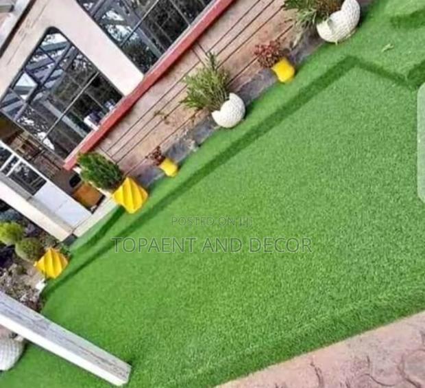 All Green Artificial Grass Carpet at the House Backyard