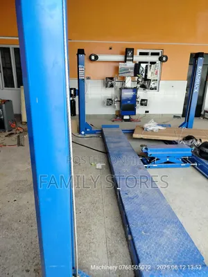 Wheel Alignment Machine With Four Post Lift .