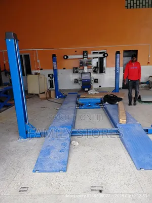Wheel Alignment Machine With Four Post Lift .