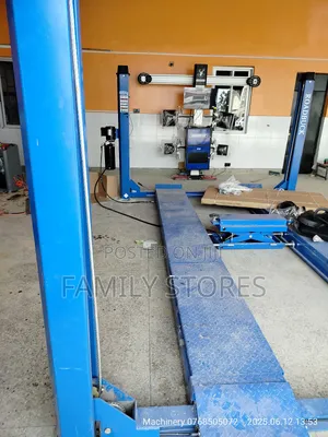 Wheel Alignment Machine With Four Post Lift .