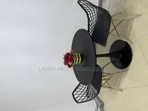 Black Table Set - A Round Table With 2 Eames Mesh Chairs