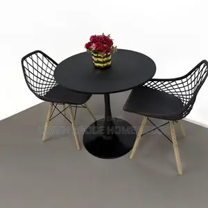 Round Black Tulip Table With 2 Black Mesh Eames Chairs