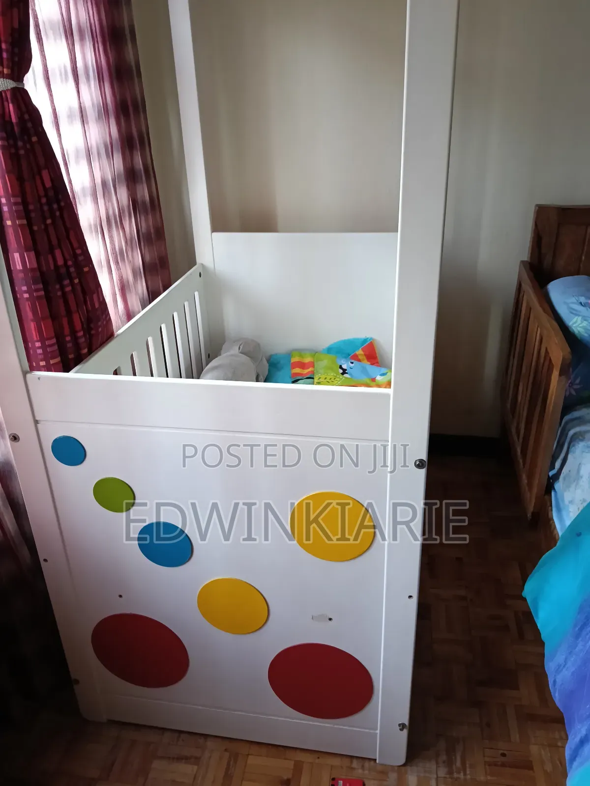 White Baby Crib With Colorful Circle Design