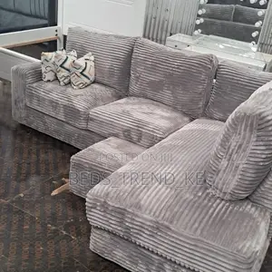 Grey 6 Seater L Seat Sofa With a Puff and Throw Pillows