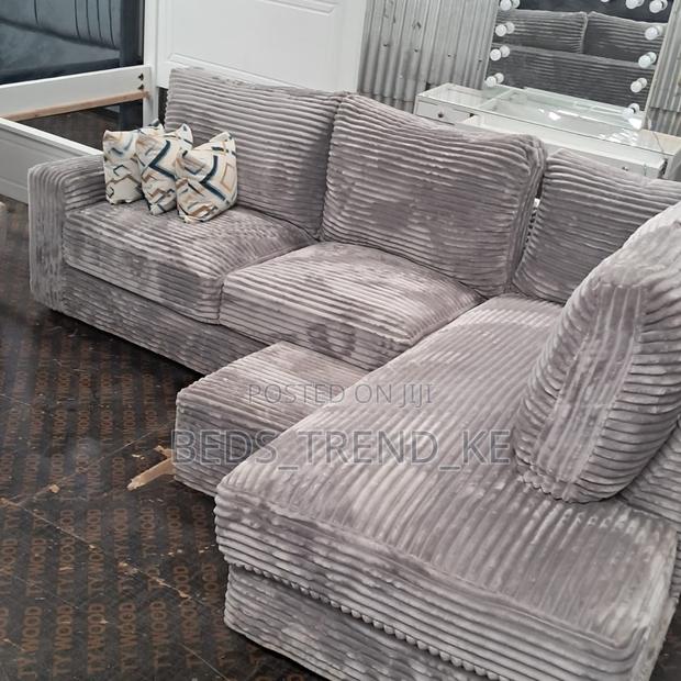 Grey 6 Seater L Seat Sofa With a Puff and Throw Pillows