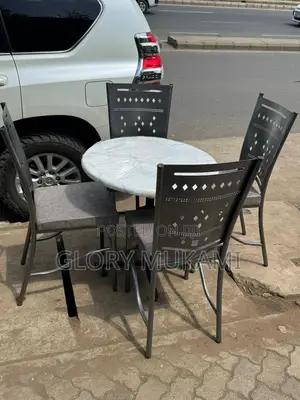 Restaurant And Bar Silver Coated Chairs And Marble Table