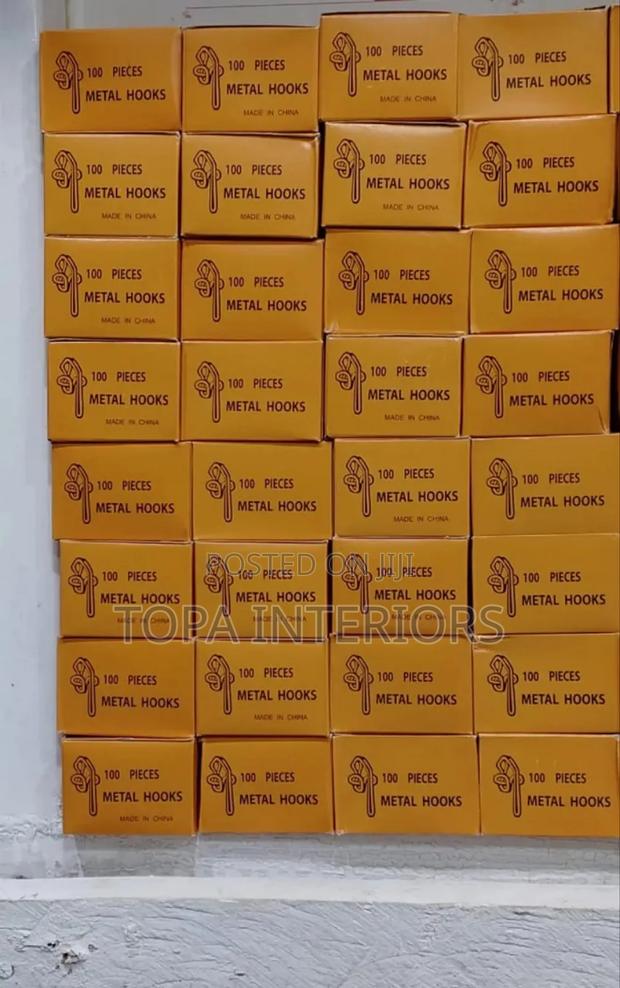 A Box of Metal Curtain Hooks With One Hundred Pieces