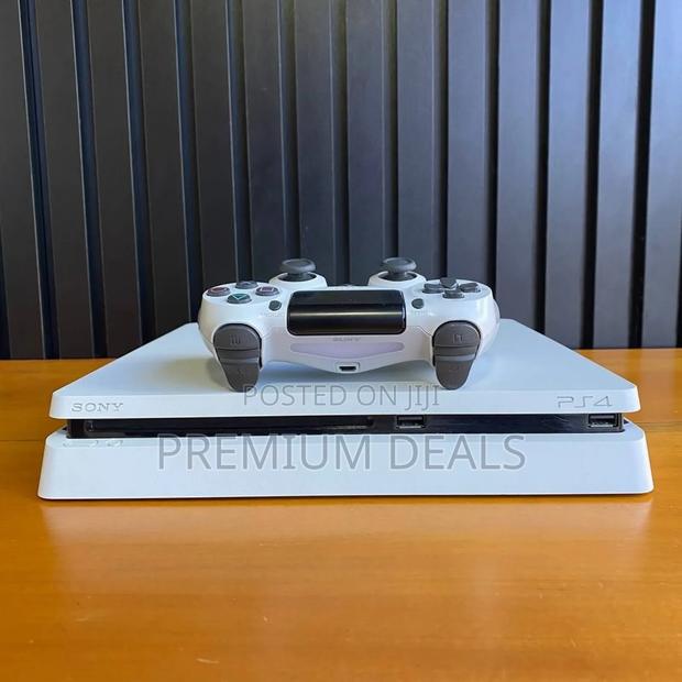 White Ps4 Slim With 10games Plus Original Controllers.