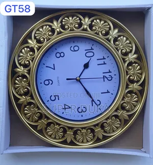 Decorative Quartz Wall Clock With a Gold-Colored Frame.