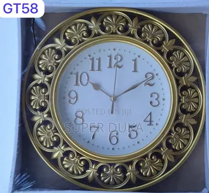 Decorative Wall Clock, Specifically a Gold Leaf Patterned.