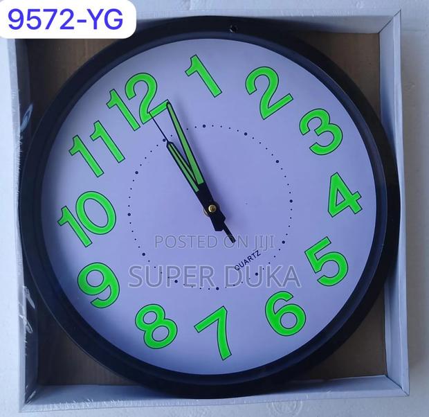 Glow-in-the-Dark Wall Clock With Luminous Numbers and Hands.
