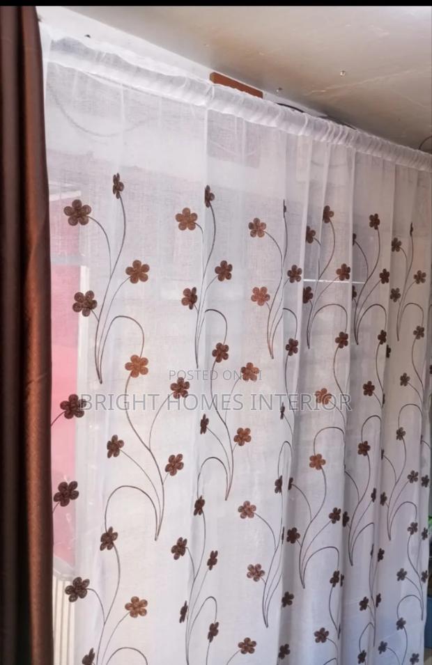 White Floral Sheer Matches Well With Brown Curtain