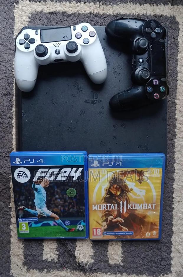 Ps4 Slim With Two Controllers Plus Two Games. - main view