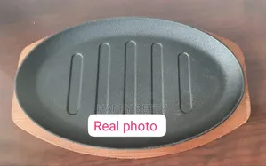 Cast Iron Hot Sizzling Plate on Wooden Tray