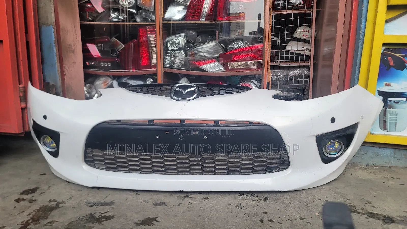 Demio Front Bumper  Complete With Foglights And Bulbs