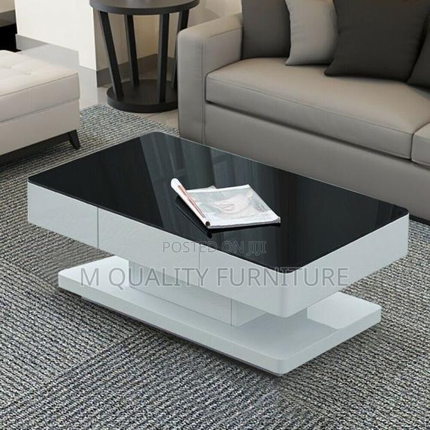 White Coffee Table With a Black Glass Tabletop