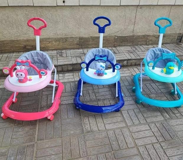 Baby Walker With Melodies, Toys, and a Push Handle.