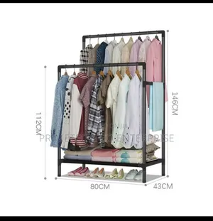 Double Pole Clothing Rack With Lower Storage Shelf.
